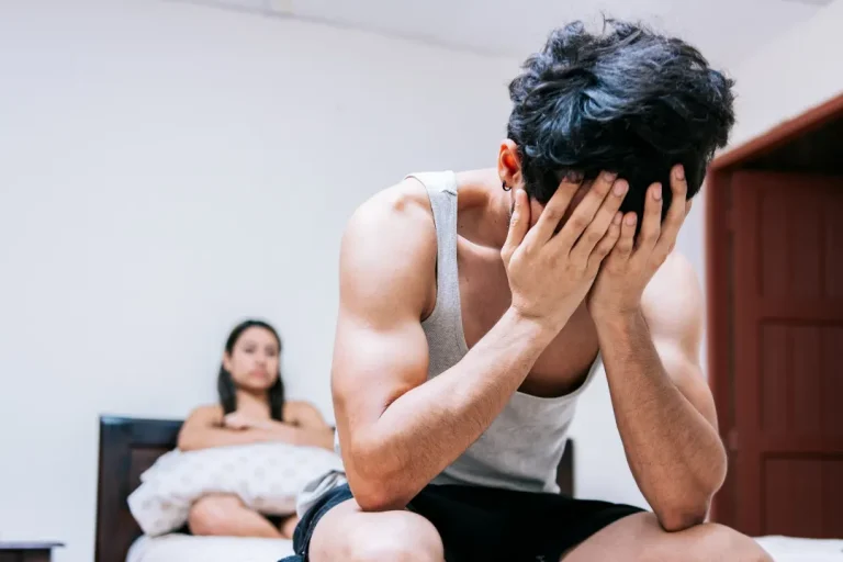 Sad and Worried Man in bed with erectile dysfunction problem.