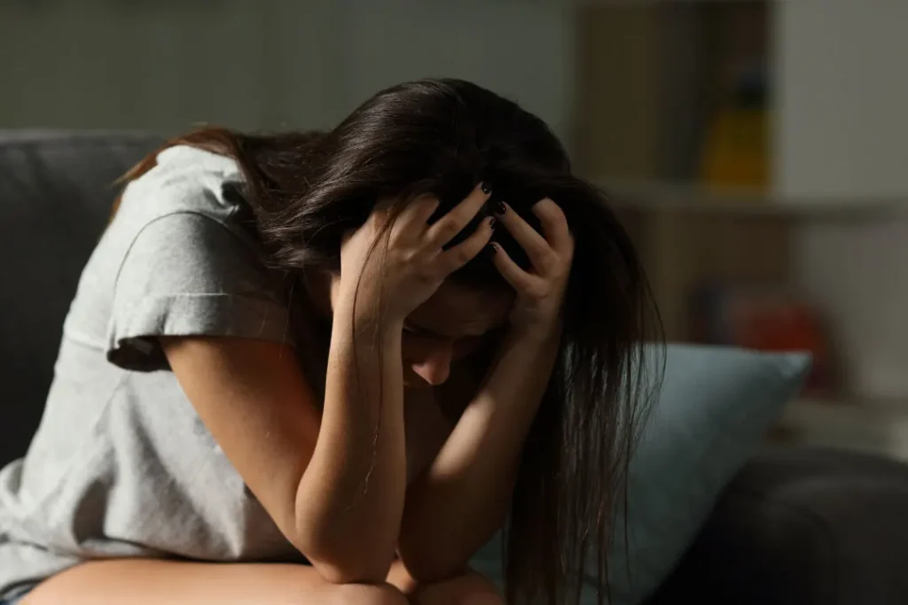 CBD for Teens: Benefits, Safety, and Tips 3 A young girl looking sad.