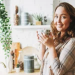 Happy-smiling-girl-drinking-tea