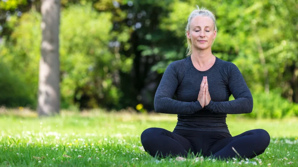 Omega 3 and Triglycerides: Unlocking the Powerful Link to Lowering Levels for Optimal Health 3 A healthy woman doing yoga for better focus and mental health