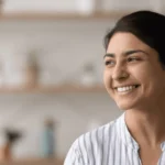 Young happy woman similing and relaxing