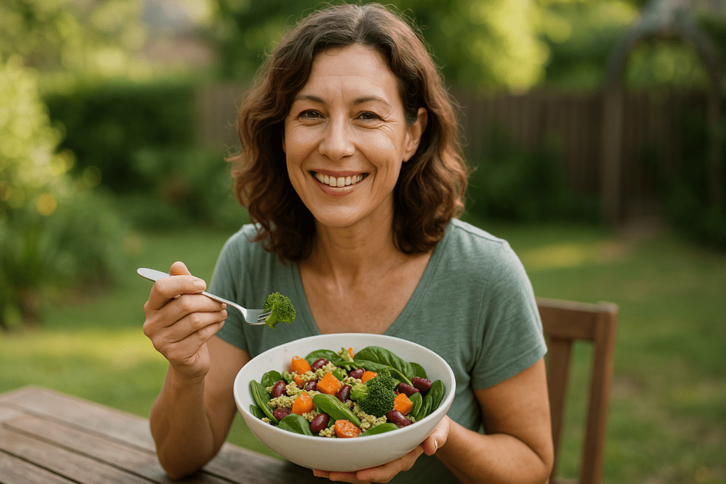 Heart-Healthy Vegetarian Recipes That Support Cardiovascular Wellness: Expert Tips and Delicious Plant-Based Dishes 2 A heart-shaped ceramic bowl containing a vibrant mix of quinoa, roasted sweet potatoes, chickpeas, kale, and cherry tomatoes rests on a dark wooden table under moody lighting with dramatic shadows. This photorealistic scene captures a heart-healthy vegetarian recipe ideal for cardiovascular wellness, emphasizing nutrient density and visual appeal in a warm, rustic setting.